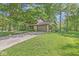 Charming two-story home with lush landscaping and a two-car garage nestled amongst mature trees at 577 Century Oaks Dr, Zionsville, IN 46077