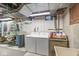 Functional laundry room with washer, dryer, and exposed ductwork, providing convenience and utility at 577 Century Oaks Dr, Zionsville, IN 46077
