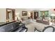 Cozy living room featuring a grand piano, comfortable seating, and natural light at 577 Century Oaks Dr, Zionsville, IN 46077
