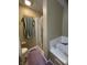 Bathroom featuring both a glass-enclosed shower and a large soaking tub at 5920 Copeland Mills Dr, Indianapolis, IN 46221