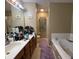 Bathroom with double sinks, long countertop, shower, and soaking tub at 5920 Copeland Mills Dr, Indianapolis, IN 46221