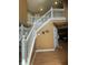 Grand foyer with a staircase features warm color walls, beautiful wood floors, and an open railing at 5920 Copeland Mills Dr, Indianapolis, IN 46221