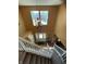 A two-story foyer with a chandelier, a white front door, and a staircase at 5920 Copeland Mills Dr, Indianapolis, IN 46221