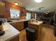 Bright kitchen with an island, connecting to the dining and living room for seamless entertaining at 5920 Copeland Mills Dr, Indianapolis, IN 46221