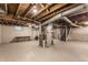 Unfinished basement with concrete floor, exposed utilities, and stairs leading to the upper level at 595 W Poplar St, Zionsville, IN 46077