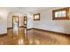 Classic Dining Room featuring polished hard wood floors, arched doorways, and vintage detailing at 595 W Poplar St, Zionsville, IN 46077
