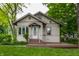 Charming home with a cozy front porch and lush landscaping enhancing its curb appeal at 595 W Poplar St, Zionsville, IN 46077