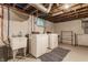 Basement laundry area equipped with a utility sink, washer, and dryer hookups at 595 W Poplar St, Zionsville, IN 46077