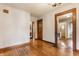 Cozy living room with hardwood floors, wood trim, and doorways leading to other rooms at 595 W Poplar St, Zionsville, IN 46077