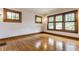 A well-lit living room with natural light, hardwood floors, and vintage light fixtures at 595 W Poplar St, Zionsville, IN 46077