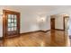 Spacious living area with polished hardwood floors and vintage light fixtures for classic feel at 595 W Poplar St, Zionsville, IN 46077
