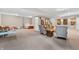 Finished basement with seating area, adjacent play area, and staircase access at 6168 Pine Bluff Dr, Avon, IN 46123