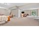Finished basement with sliding doors, bed, TV, and seating area at 6168 Pine Bluff Dr, Avon, IN 46123
