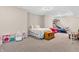 Bedroom area in finished basement with bed and play area featuring a toy chest at 6168 Pine Bluff Dr, Avon, IN 46123