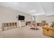 Finished basement featuring plush carpeting, comfortable seating, TV, and ample space at 6168 Pine Bluff Dr, Avon, IN 46123