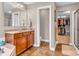 Nicely appointed bathroom with dual sinks, quartz countertop, and a walk-in closet at 6168 Pine Bluff Dr, Avon, IN 46123