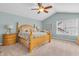 Vaulted bedroom with four-poster bed, ceiling fan, and bright natural light at 6168 Pine Bluff Dr, Avon, IN 46123