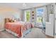 Bright and airy bedroom features a large window and charming rainbow mural at 6168 Pine Bluff Dr, Avon, IN 46123