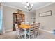 Traditional dining room featuring a wood table, matching hutch, and neutral walls at 6168 Pine Bluff Dr, Avon, IN 46123