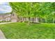 Lovely brick home with a green lawn and mature trees, creating a serene setting at 6168 Pine Bluff Dr, Avon, IN 46123