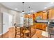 Kitchen with stainless steel appliances, ample cabinet space, and an island with seating at 6168 Pine Bluff Dr, Avon, IN 46123