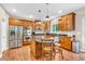 Gourmet kitchen featuring stainless steel appliances, granite countertops, and a central island at 6168 Pine Bluff Dr, Avon, IN 46123