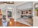 Bright living room featuring neutral carpeting and views into the entry way and staircase at 6168 Pine Bluff Dr, Avon, IN 46123