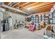 Unfinished basement with exposed ceiling, water heater, shelving, and storage at 6168 Pine Bluff Dr, Avon, IN 46123