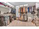Well-organized walk-in closet offers ample storage space with custom shelving and hanging racks at 6168 Pine Bluff Dr, Avon, IN 46123