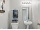 Cozy half bathroom featuring modern fixtures, and soft lighting at 6552 Hunters S Rdg, Zionsville, IN 46077