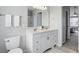 Bathroom with double sink vanity, white cabinets and an entry to an additional room at 6552 Hunters S Rdg, Zionsville, IN 46077