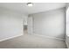 Empty bedroom with a window and neutral-colored carpeting at 6552 Hunters S Rdg, Zionsville, IN 46077