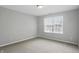 Bedroom with a window and neutral-colored carpeting at 6552 Hunters S Rdg, Zionsville, IN 46077