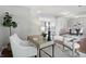 Stylish home office area featuring a desk and chair in a brightly lit open space at 6552 Hunters S Rdg, Zionsville, IN 46077