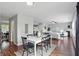 Open-concept living and dining area featuring hardwood floors and neutral décor at 6552 Hunters S Rdg, Zionsville, IN 46077
