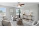 Upstairs living room featuring neutral decor, comfortable seating, and ample natural light at 6552 Hunters S Rdg, Zionsville, IN 46077