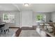 Bright and airy living room with hardwood floors and modern furniture, illuminated by natural light at 6552 Hunters S Rdg, Zionsville, IN 46077
