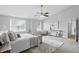 Spacious main bedroom suite featuring lots of natural light and soft, neutral decor at 6552 Hunters S Rdg, Zionsville, IN 46077