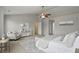 Bright, spacious main bedroom with neutral colors, carpet, and fan at 6552 Hunters S Rdg, Zionsville, IN 46077