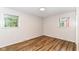 Cozy bedroom featuring bright windows and wood floors at 7050 N County Road 650 E, Brownsburg, IN 46112