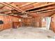 Spacious garage featuring a large white door, workbench, and ample storage space for vehicles and tools at 7050 N County Road 650 E, Brownsburg, IN 46112