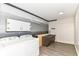 Well-lit laundry room featuring gray accent wall and modern washer and dryer at 7050 N County Road 650 E, Brownsburg, IN 46112