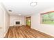 Spacious living room features a brick fireplace and sliding door leading to the backyard at 7050 N County Road 650 E, Brownsburg, IN 46112