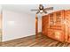 Living room featuring wood paneling and hardwood floors at 7050 N County Road 650 E, Brownsburg, IN 46112