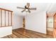 Open-concept living room featuring hardwood floors and stairs with wooden trim at 7050 N County Road 650 E, Brownsburg, IN 46112