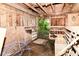 Rustic shed with wooden walls, open door, and visible wooden rafters, offering potential storage or workspace at 7050 N County Road 650 E, Brownsburg, IN 46112