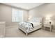 Inviting bedroom with a white bed frame, plush bedding, and ample natural light at 7152 Cherry Creek Blvd, Carmel, IN 46033