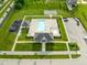 Aerial view of the community pool, playground, basketball court, and parking lot at 7152 Cherry Creek Blvd, Carmel, IN 46033