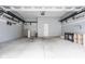 Spacious garage with gray walls, a white door, and metal storage racks installed at 7152 Cherry Creek Blvd, Carmel, IN 46033