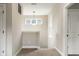 Bright hallway with neutral paint, carpet flooring, and a decorative pendant light at 7152 Cherry Creek Blvd, Carmel, IN 46033